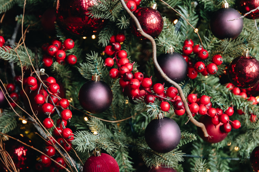 Close Up of a Christmas Tree with berries and baubles during a twixmas break in Glasgow, Scotland at Mar Hall Luxury Hotel & Resort  